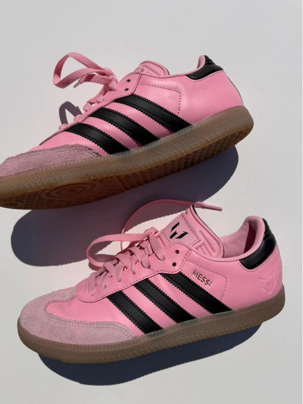 Adidas Messi pink and black tennis shoes size 8.5 men’s 10.5 women’s